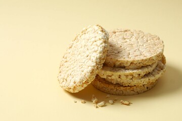 Round rice cakes on color background 