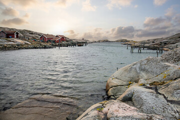 Beautiful village landscape in a fjord. Fishermen and restaurants in the evening at sunset. Boats...