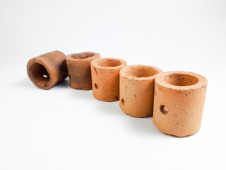 Mini clay pot isolated on white background, this pot is usually used for aquatic plants in aquascapes.