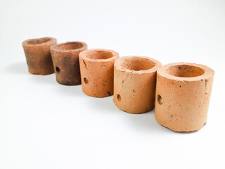 Mini clay pot isolated on white background, this pot is usually used for aquatic plants in aquascapes.