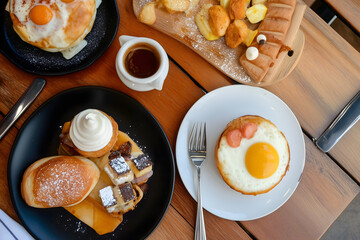 Delicious Breakfast with Sunny Side Up Eggs Crepes and Coffee on Wooden Table