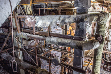 Old abandoned paper factory. Historical and typical factory building as a lost place. Riots and decay take a toll on the substance. Original machines and objects can be found here in Sweden