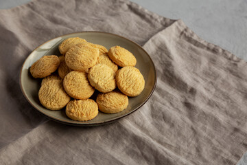 Homemade Cookies with Limoncello and candied lemon paste on a plate. Pasticcini al Limoncello