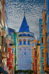 Galata Tower: A close-up photo of Galata Tower, one of the famous landmarks of Istanbul, taken at sunrise. A magnificent view of the clouds in the background.