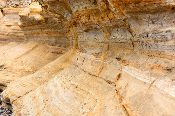 Closeup of coastal lime rock geological cliff formation at Tourmaline surfing park (angular shot...