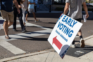 Unrecognizable people on their way to early voting for the 2024 election in the United States