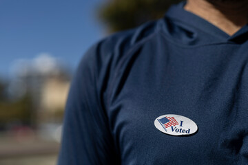I Voted sticker stuck on a voter's shirt. Elections 2024 United States