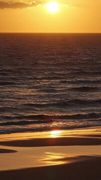 Golden hour on the beach. Cuesta Maneli, Arenosillo, Do&ntilde;ana, Matalasca&ntilde;as, Mazagon, Huelva, Spain, Andalusia, Holidays, Relaxation, orange color, golden color.