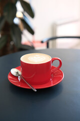 Experience the Delight of Delicious Coffee Served in a Vibrant and Eyecatching Red Cup