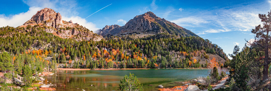 Aig&uuml;estortes i Estany de Sant Maurici National Park. Panoramic view of Estany de Ratera (Lake Ratera)