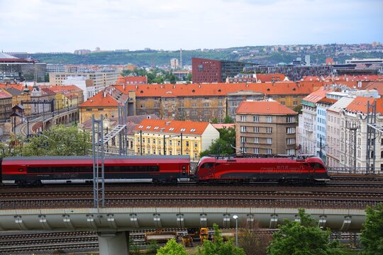 PRAGUE, CZECH REPUBLIC - MAY 3, 2024: Railjet brand passenger train in Prague. Railjet is a high-speed rail service operated by Austrian Federal Railways (OBB) and Czech Railways (CD).