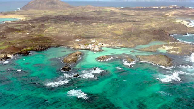 Aerial view over the coast and beaches in Lobos Island, on the Atlantic Island of Fuerteventura, Spain.