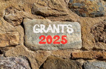 Planning grants 2025 new year symbol. Concept words Grants 2025 on beautiful grey stone. Beautiful...