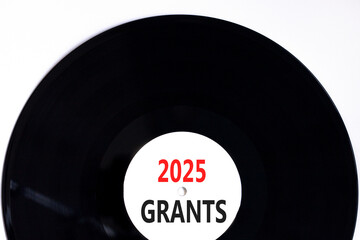 Planning 2025 grants new year symbol. Concept words 2025 Grants on beautiful white and black vinyl disk. Beautiful white background. Business 2025 grants new year concept. Copy space.