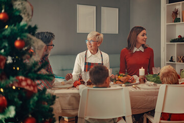 Happy family enjoying christmas dinner together at home