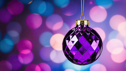 Obraz premium Purple ornament hanging against a colorful bokeh background, festive decoration.