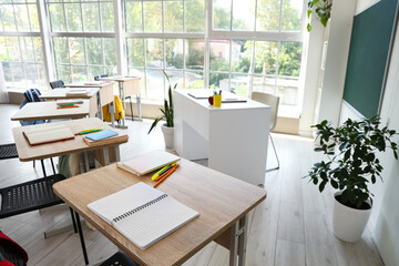 Interior of empty classroom with school desks