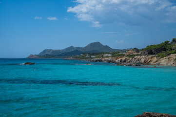 Obraz premium Cala Rajada near son moll beach, Mallorca with sea in front and mountain range in the background, wide angle shot, majorca spain