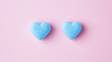 Fototapeta premium Heartwarming Pastel Love - Soft Blue Hearts on Pink Background