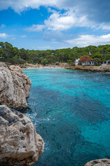 Obraz premium Cala Gat Beach at Cala Rajada, Mallorca, sea with sand beach, vertical shot, majorca spain