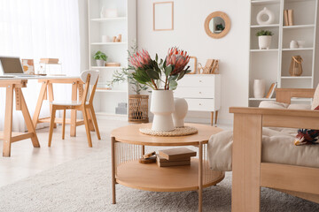 Interior of living room with protea flowers