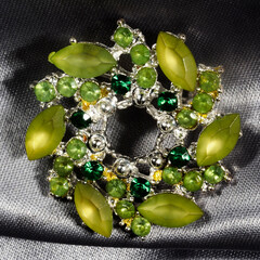 Antique brooch with multi-colored glass in the shape of precious stones, made in Germany