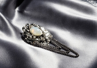 Vintage brooch made of silver metal with artificial pearls and chain, made in Czech Republic