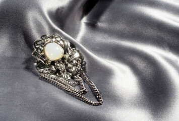 Vintage brooch made of silver metal with artificial pearls and chain, made in Czech Republic