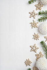 Elegant Christmas background with festive decorations: pine branches, ornaments, shiny stars, and confettiф. Perfect for greeting cards, web banners, and holiday invitations