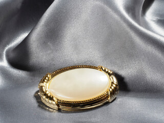 Vintage brooch made of yellow metal with artificial pearls, made in Czech Republic