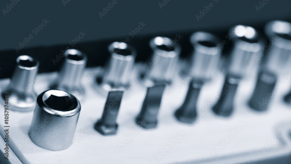 Poster A row of tools with a variety of sizes and shapes. Concept of organization and order, as the tools are neatly arranged in a row. The variety of sizes