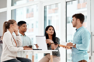 Man, business people and office meeting with discussion, notebook or listen in circle at startup...