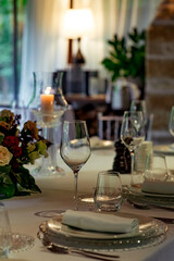 Beautiful table setting, for a holiday. with the dishes .flowers and candles