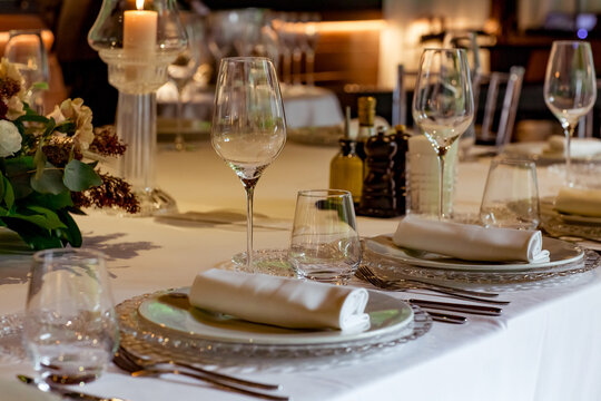 Beautiful table setting, for a holiday. with the dishes .flowers and candles