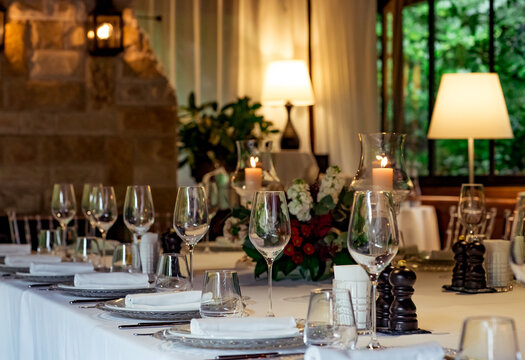 Beautiful table setting, for a holiday. with the dishes .flowers and candles