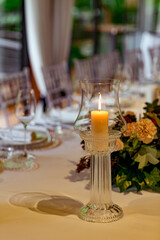 Beautiful table setting, for a holiday. with the dishes .flowers and candles
