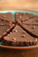 Chocolate cake, with choco pieces topping, subjective focus, vertical