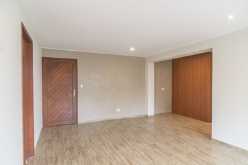 sala de departameto con vista a kitchenette, acabados modernos y piso de melamina