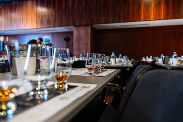 Group of tasting glasses set for cocktail preparation event at a venue