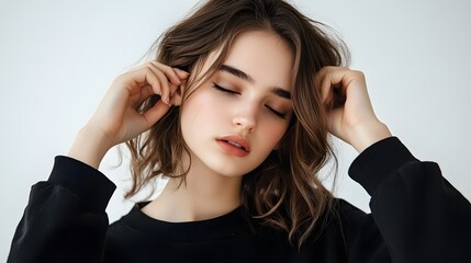 Fototapeta premium A woman with a black shirt and brown hair
