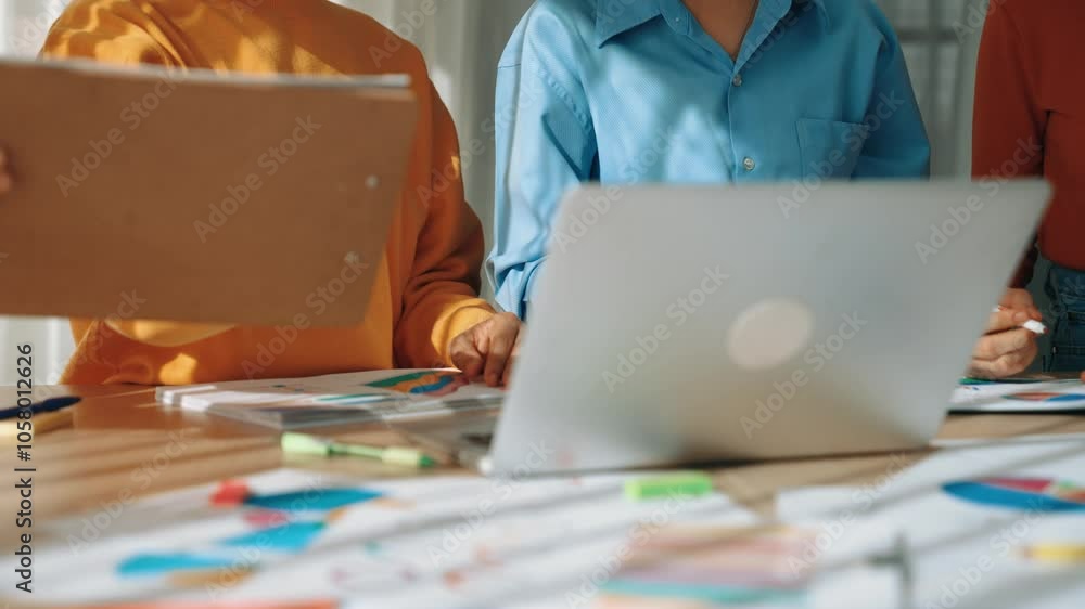 Poster startup company employee working together using laptop analyzing bi dashboard paper on financial dat