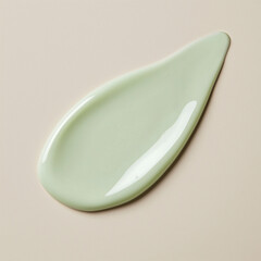 Pale light green cream swatch on a neutral beige background. Calming face lotion or lightweight moisturizing cream texture.