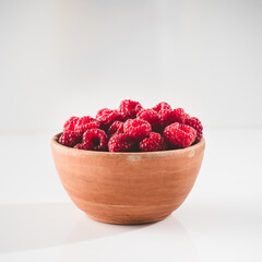 Fresh Raspberries: Juicy, Ripe Berries for a Healthy Summer Snack on a white background