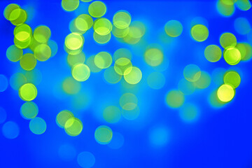 festive christmas blue background with yellow bokeh lights