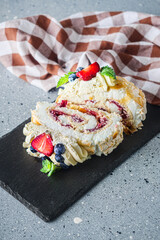 Delicate Meringue Roulade with Blueberries, Strawberries, and Mascarpone Cream