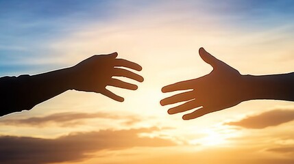 Two hands reaching out towards each other against a beautiful sunset, symbolizing connection and unity.