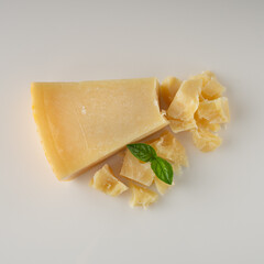 Authentic Italian Parmigiano Reggiano: Aged Cheese Wedge Isolated on White Background