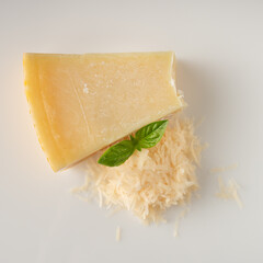 Authentic Italian Parmigiano Reggiano: Aged Cheese Wedge Isolated on White Background