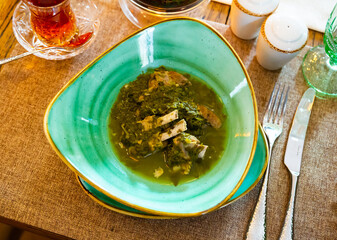 Chakapuri - lamb on the bone, stewed in white wine, with tarragon, green onions and tkemali sauce