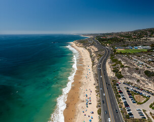 Aerial shot near the water of Pacific Coast Highway running through Newport Beach © Thomas